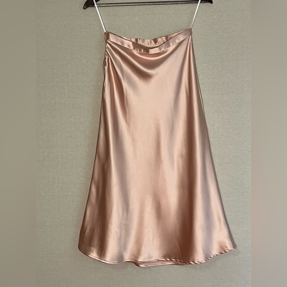 Soft light peach high waisted satin midi skirt with side zipper